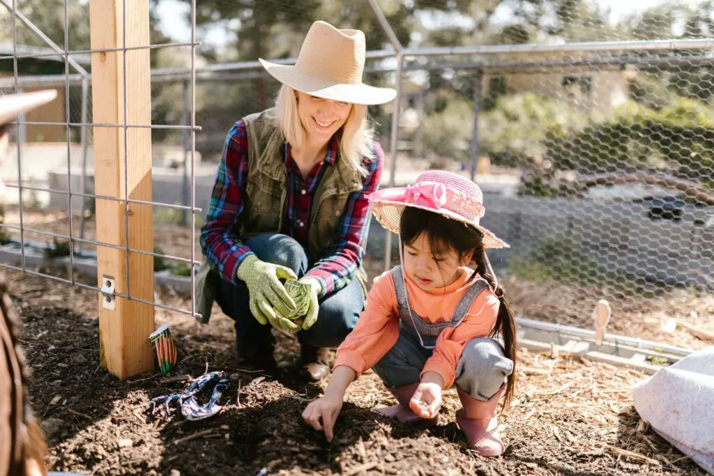 Woman and child digging in the garden.